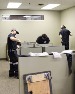 team Setting up cubicles