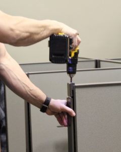 Man setting up cubicles