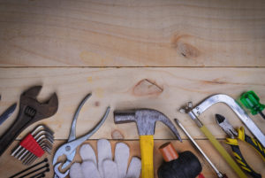 tool renovation on wood plank table